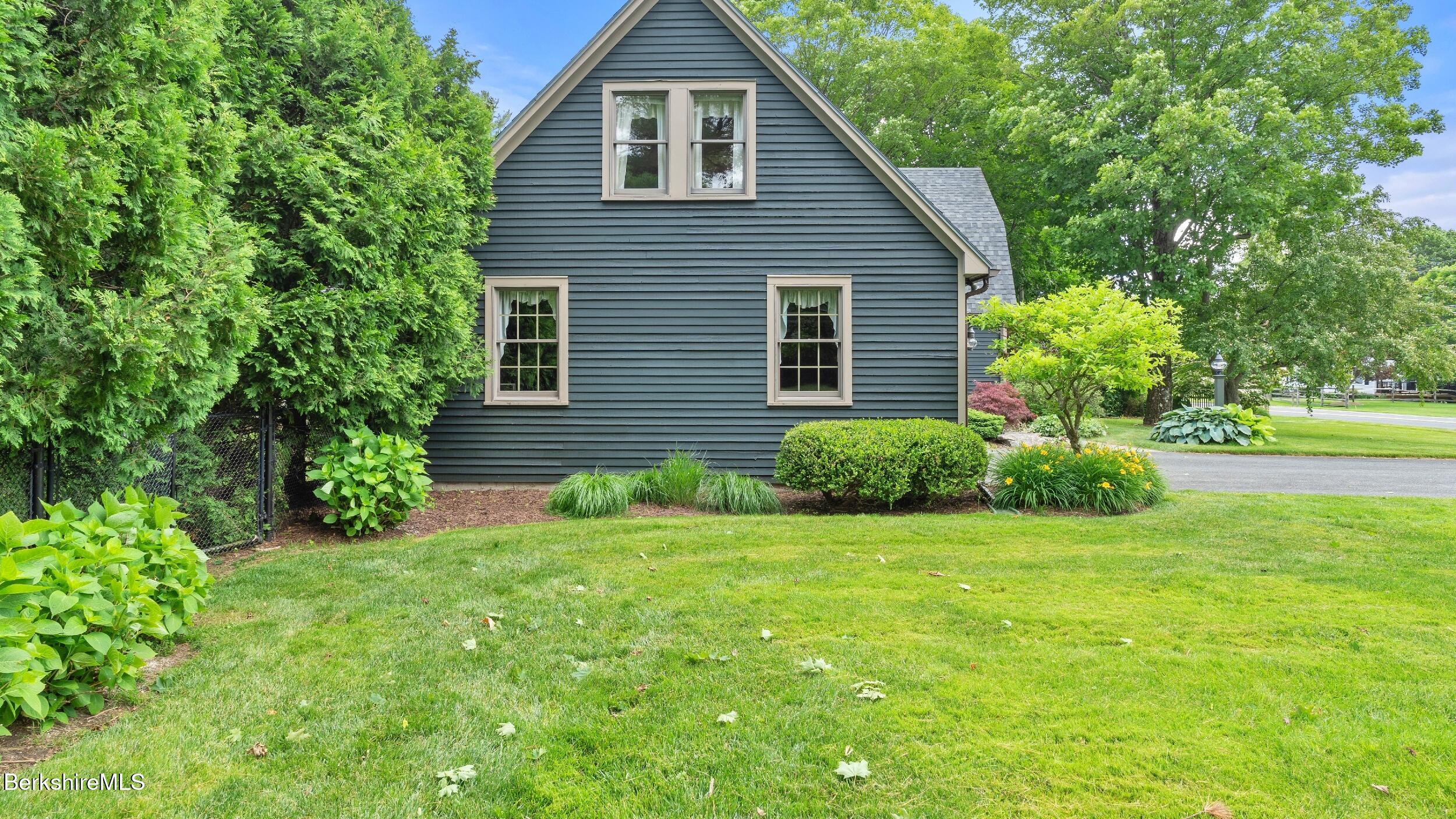 51 New Lenox Road Lenox, MA 01240 - Photo 34 of 38 a view of a house with a yard