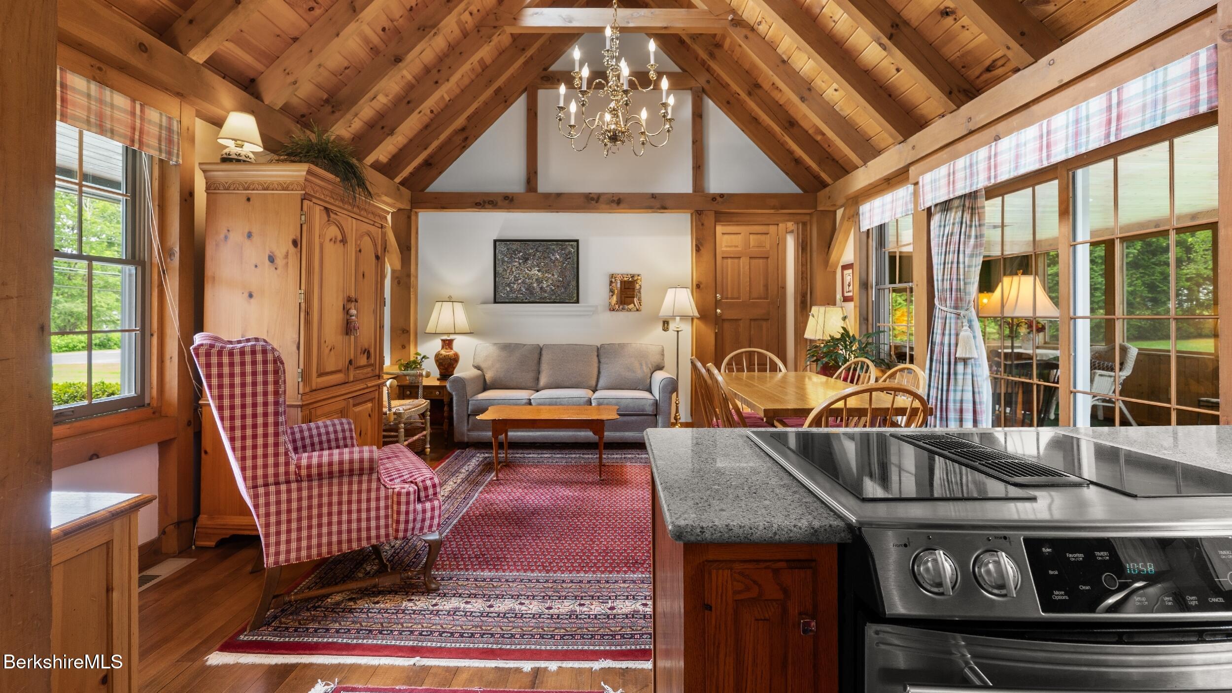51 New Lenox Road Lenox, MA 01240 - Photo 8 of 38 a living room with furniture and a floor to ceiling window