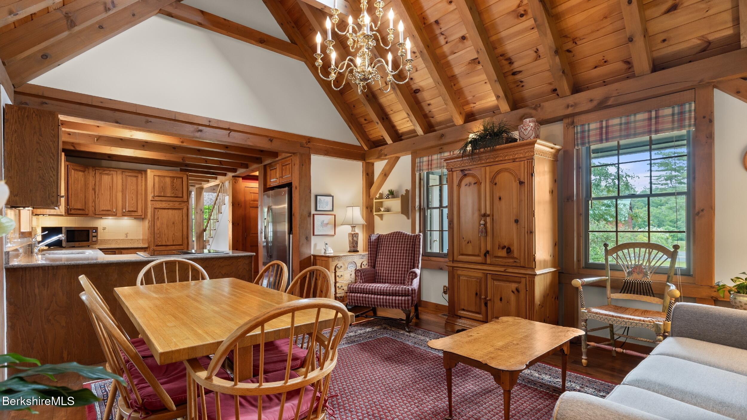 51 New Lenox Road Lenox, MA 01240 - Photo 9 of 38 a living room with furniture a ceiling fan and a rug