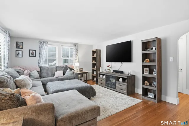 a living room with furniture and a flat screen tv
