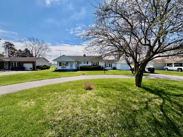 3079 Rocky Point Road Springfield, OH 45502 - Photo 36 of 37 This ranch-style home is nestled on a spacious lot with a sprawling lawn.