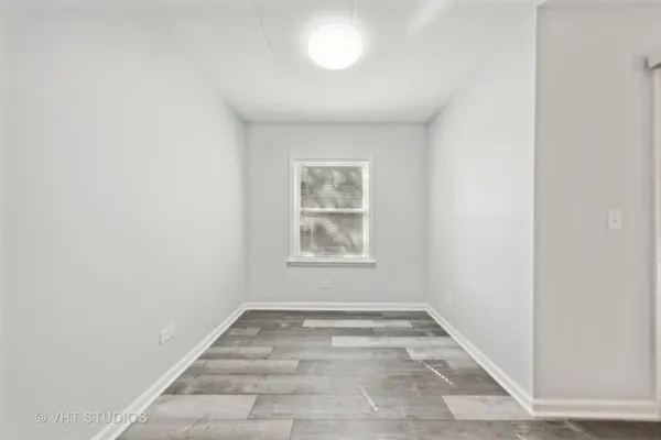 a view of a room that has a window in it
