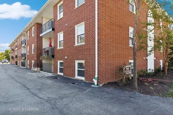 a view of a building with a yard