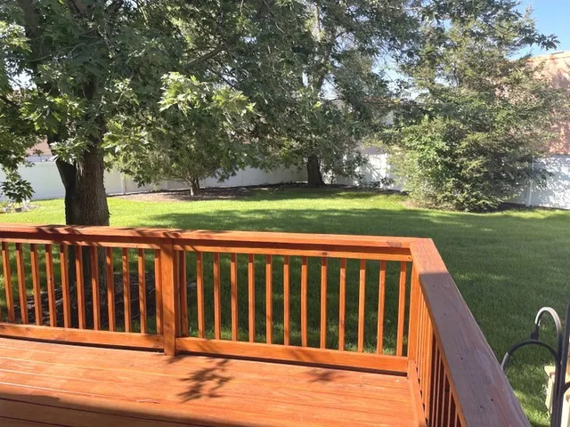 a view of outdoor space with deck and yard