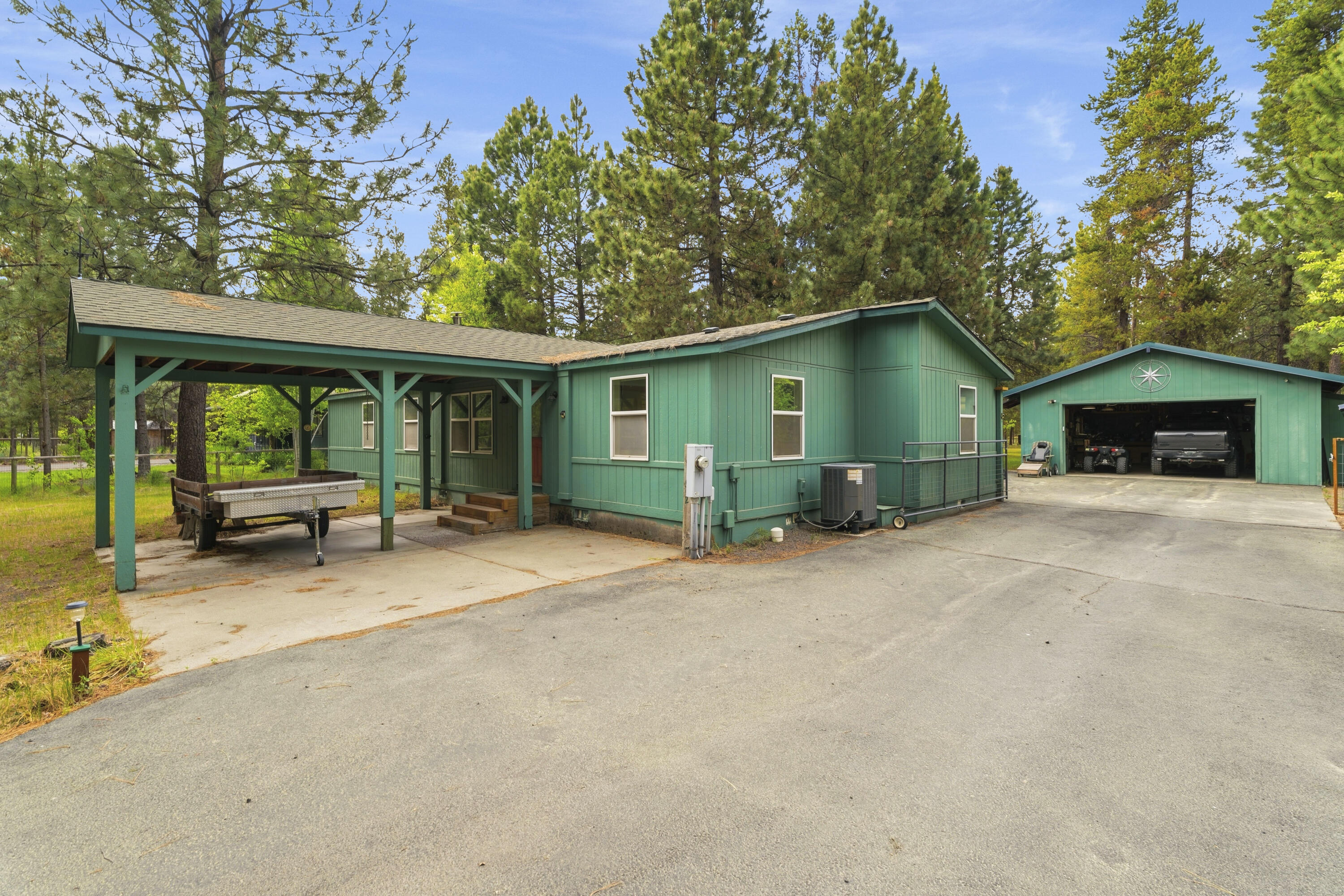 16928 Covina Road Bend, OR 97707 - Photo 37 of 48 a view of a house with backyard and glass windows