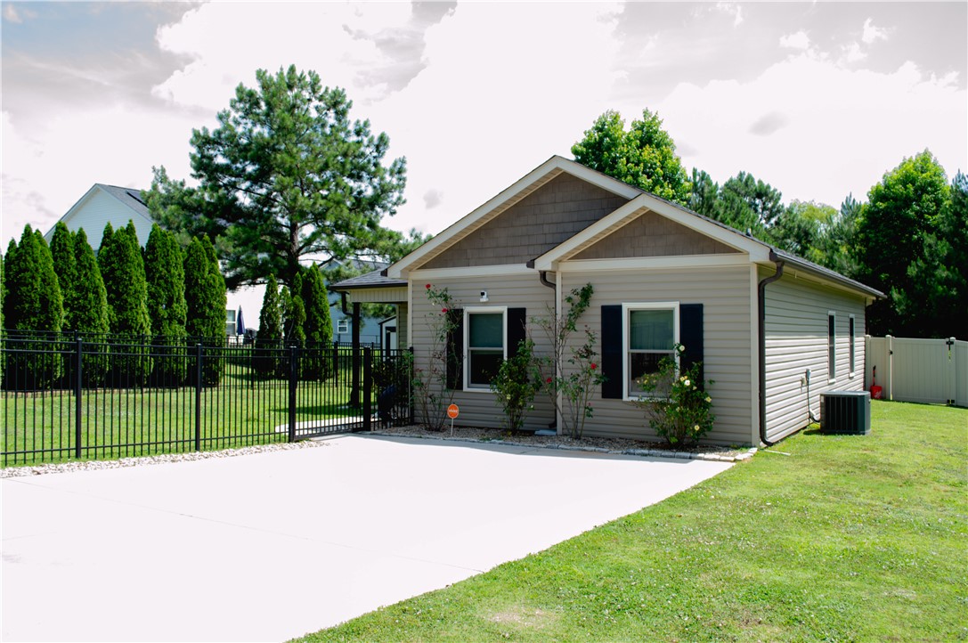3 Cringle Lane Anderson, SC 29625 - Photo 24 of 26 A charming single-story residence boasts neat landscaping and a generous concrete driveway.