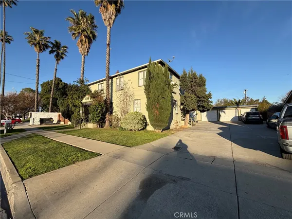 a view of a street with a cars park
