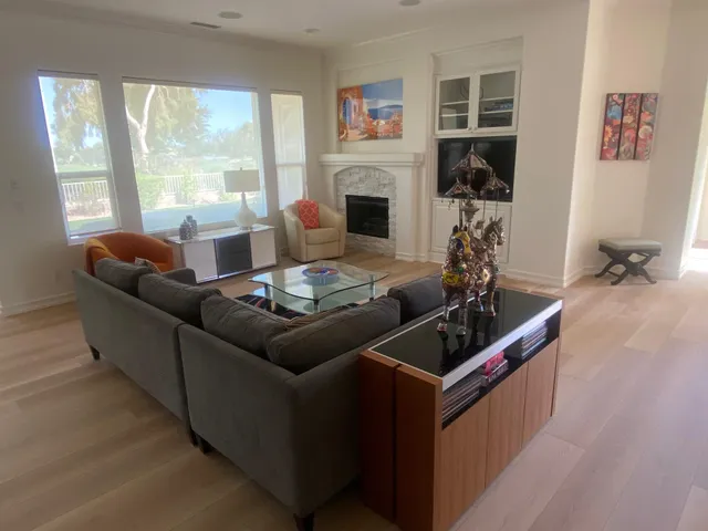 a spacious bathroom with a granite countertop sink a mirror and a bathtub