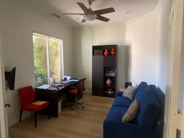 a bedroom with a bed chair and window