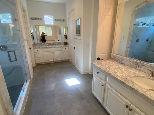 a bedroom with a bed and flat screen tv