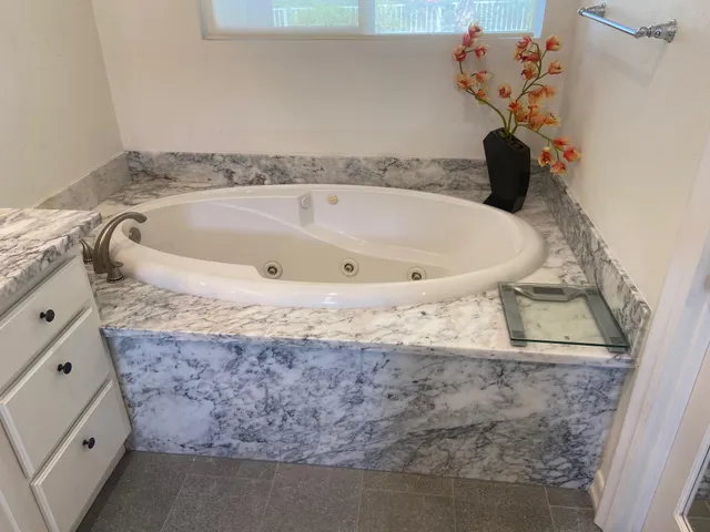a view of a living room with furniture and a potted plant