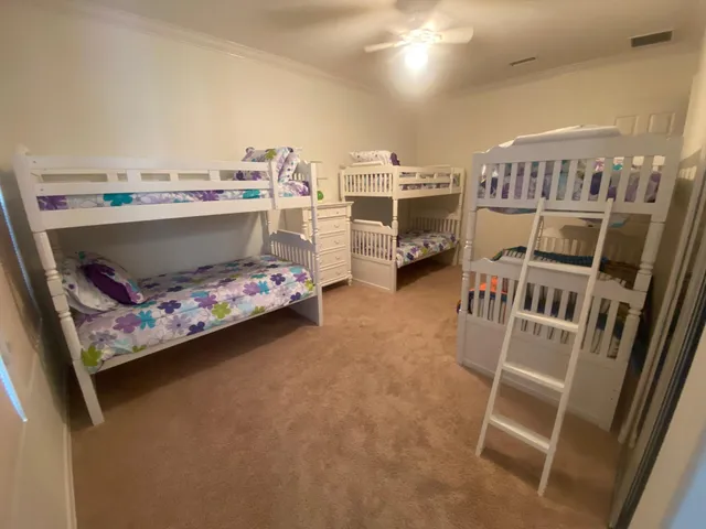 a living room with lots of furniture and a large window
