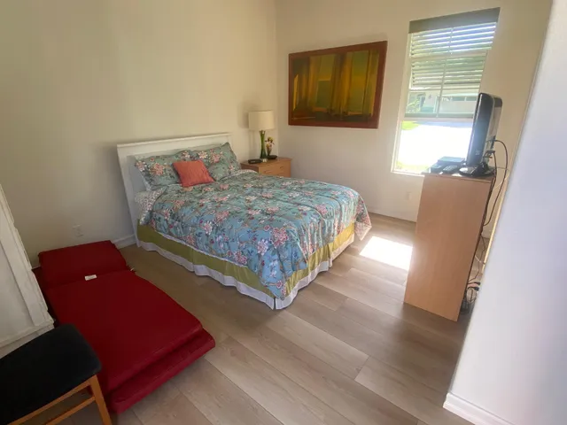 a view of swimming pool with outdoor seating and city view