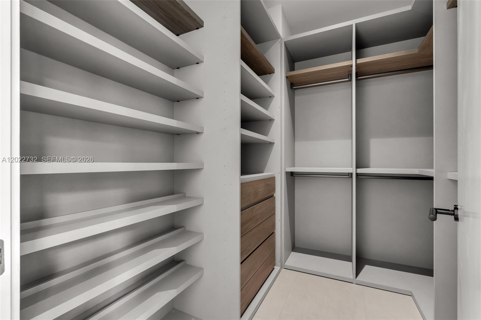 7825 Southwest 128th Street Pinecrest, FL 33156 - Photo 49 of 88 a view of walk in closet with empty racks