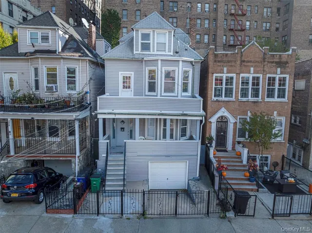 a front view of a building with a yard glass top table and chairs