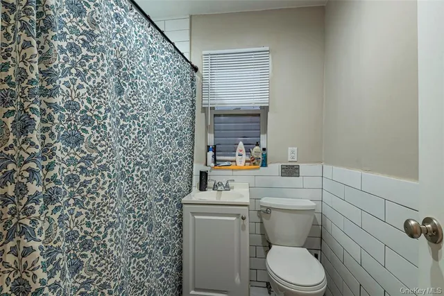 a bathroom with a toilet and sink