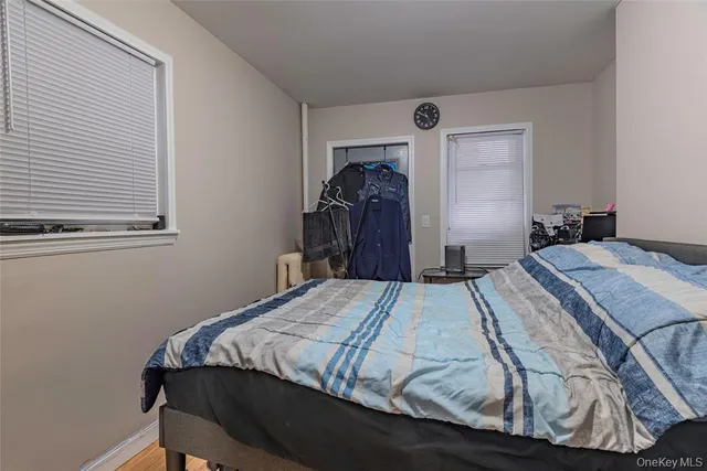 a bedroom with a bed and a closet