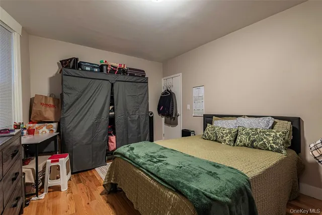 a bedroom with a bed and a closet