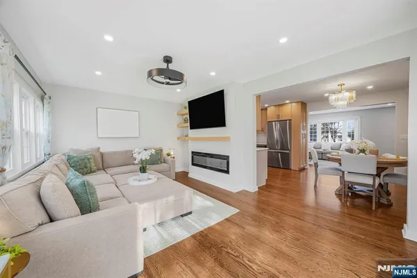 a living room with fireplace furniture and a flat screen tv