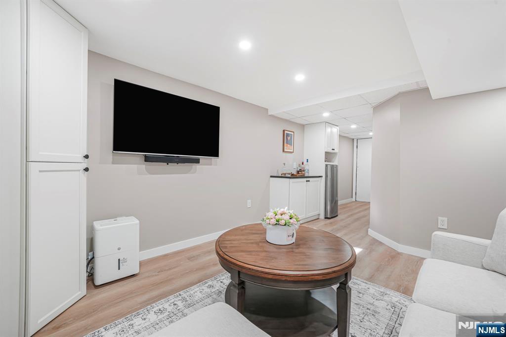 21 Joseph Place Wayne, NJ 07470 - Photo 21 of 32 a living room with furniture and a flat screen tv