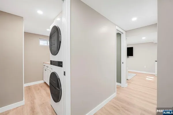 a view of a hallway with washer and dryer