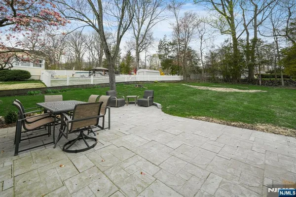 a view of a table and chairs in the garden