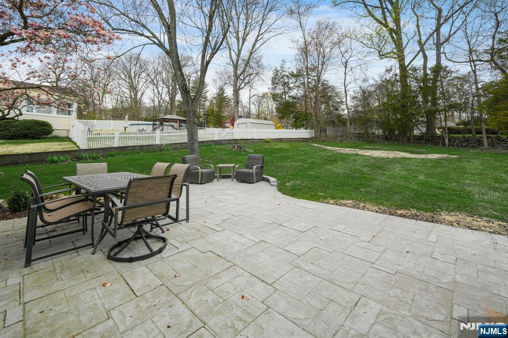 21 Joseph Place Wayne, NJ 07470 - Photo 28 of 32 a view of a table and chairs in the garden