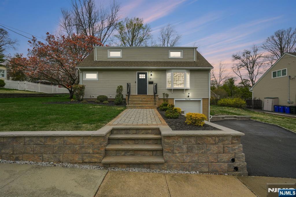 21 Joseph Place Wayne, NJ 07470 - Photo 29 of 32 a front view of a house with a yard
