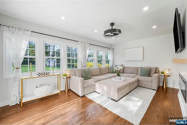 a living room with furniture and a flat screen tv