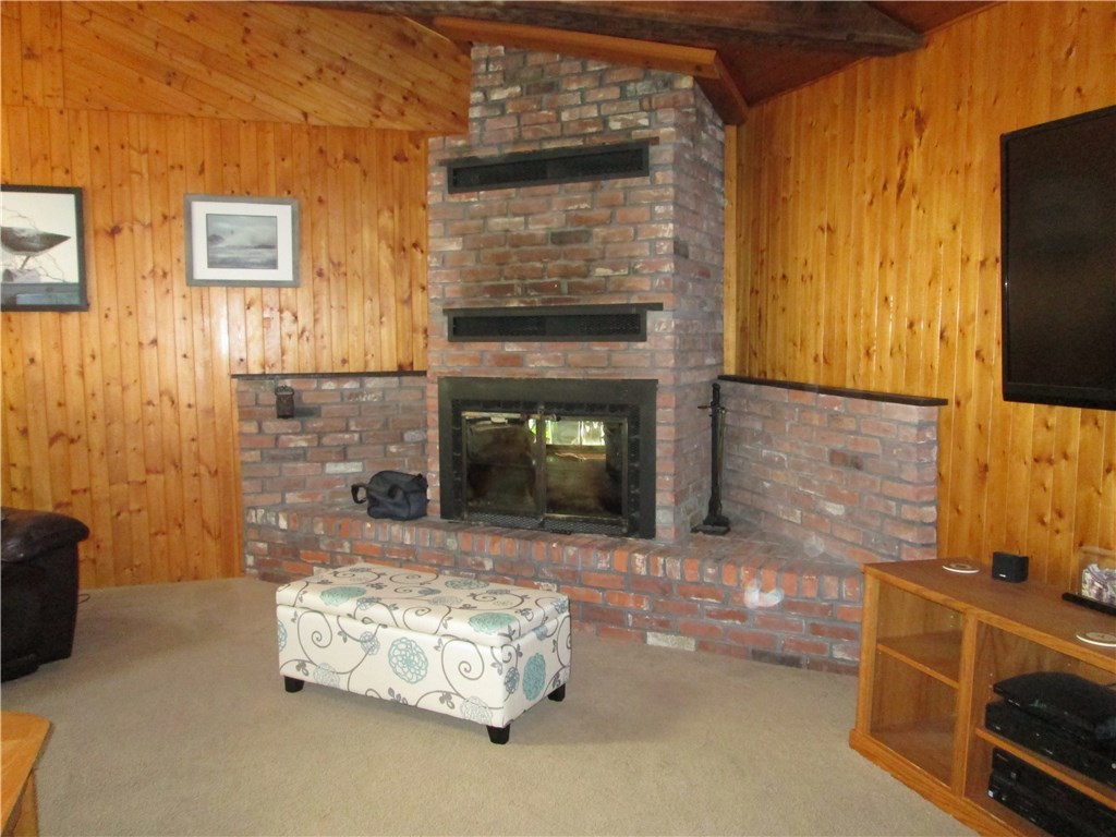 90 Scott Road Cumberland, RI 02864 - Photo 34 of 37 CATHEDRAL FAMILY ROOM WITH CORNER BRICK FIREPLACE