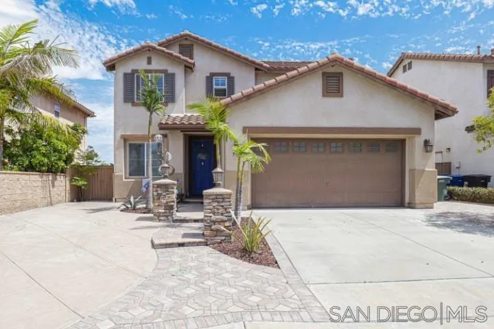 a front view of a house with yard