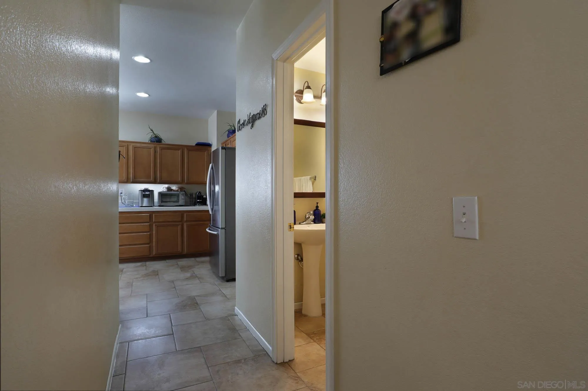 914 Rigley Street Chula Vista, CA 91911 - Photo 16 of 35 a kitchen with a refrigerator and a sink