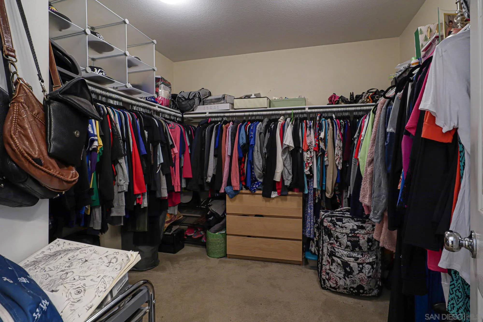 914 Rigley Street Chula Vista, CA 91911 - Photo 22 of 35 a view of walk in closet with clothes and shoes