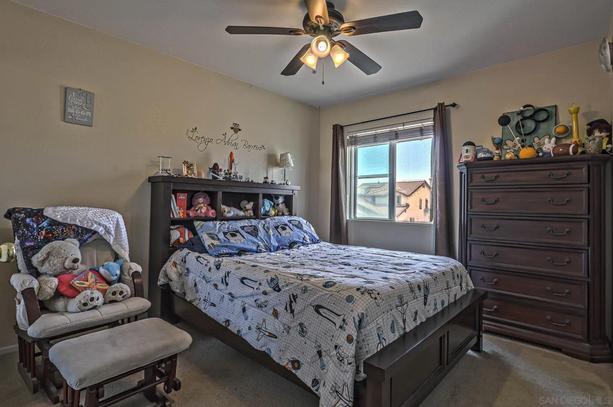 914 Rigley Street Chula Vista, CA 91911 - Photo 23 of 35 a bedroom with a bed and wooden floor