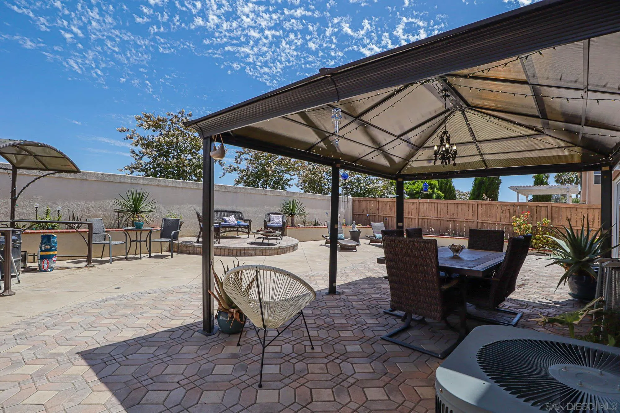 914 Rigley Street Chula Vista, CA 91911 - Photo 32 of 35 a view of a patio with a table and chairs