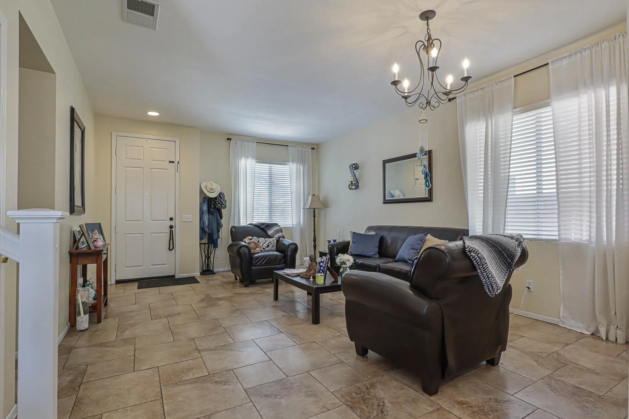 914 Rigley Street Chula Vista, CA 91911 - Photo 5 of 35 a living room with furniture and a chandelier