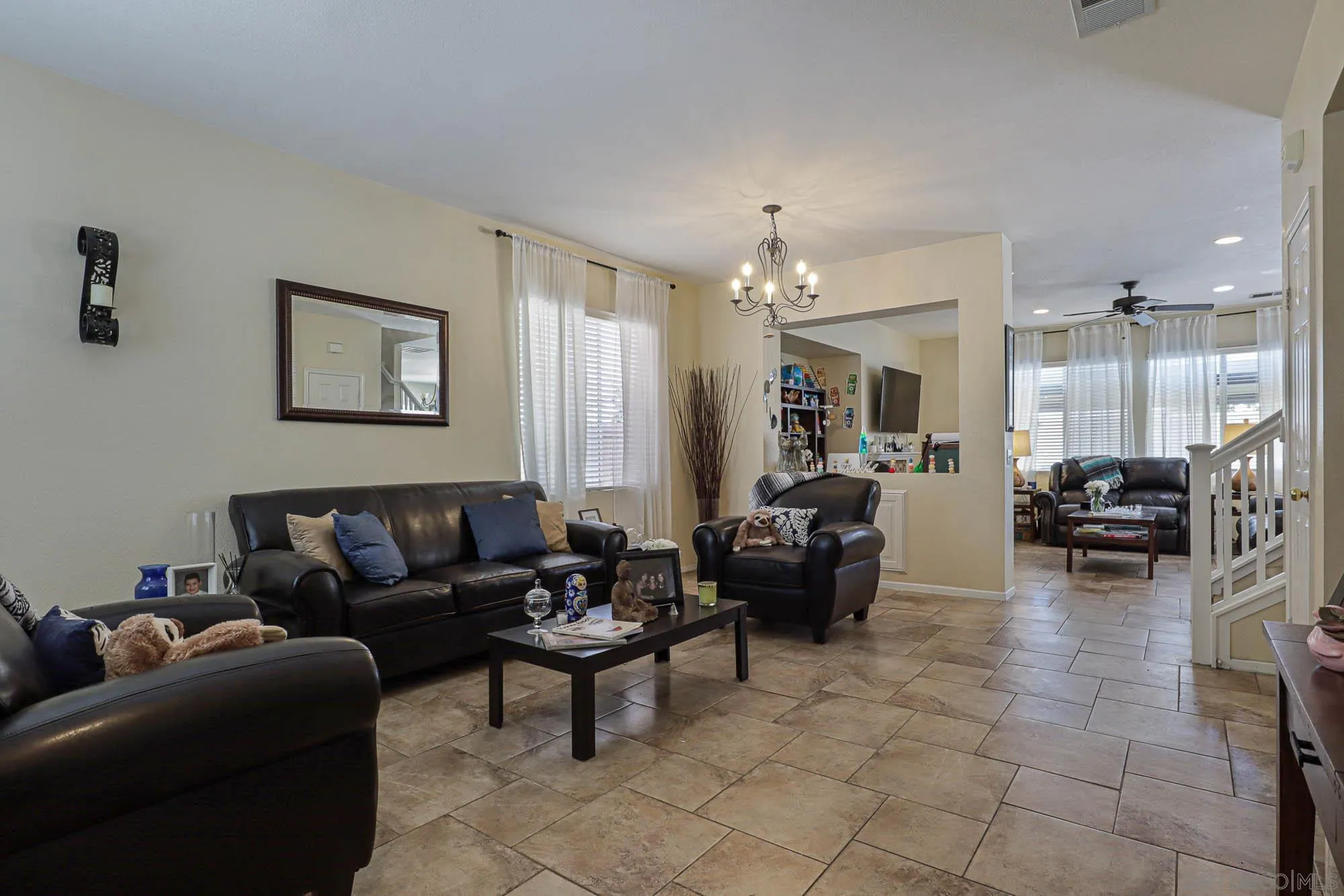 914 Rigley Street Chula Vista, CA 91911 - Photo 6 of 35 a living room with furniture and a chandelier
