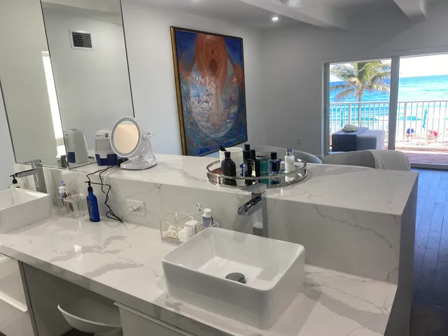 a bathroom with a double vanity sink and a mirror