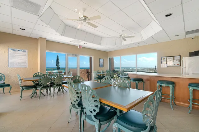 a view of a house with a swimming pool and a chair