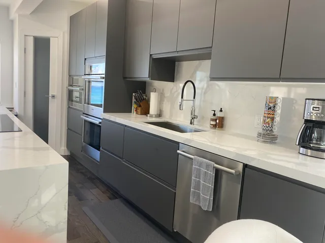 a kitchen with a table chairs and microwave