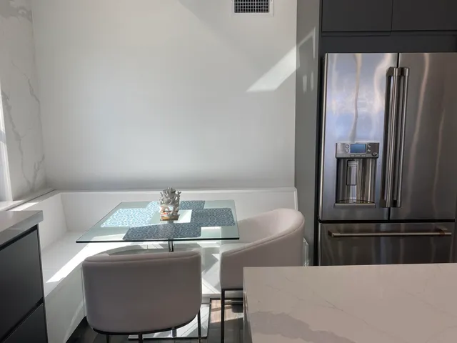 a white bath tub sitting in a bathroom next to a sink