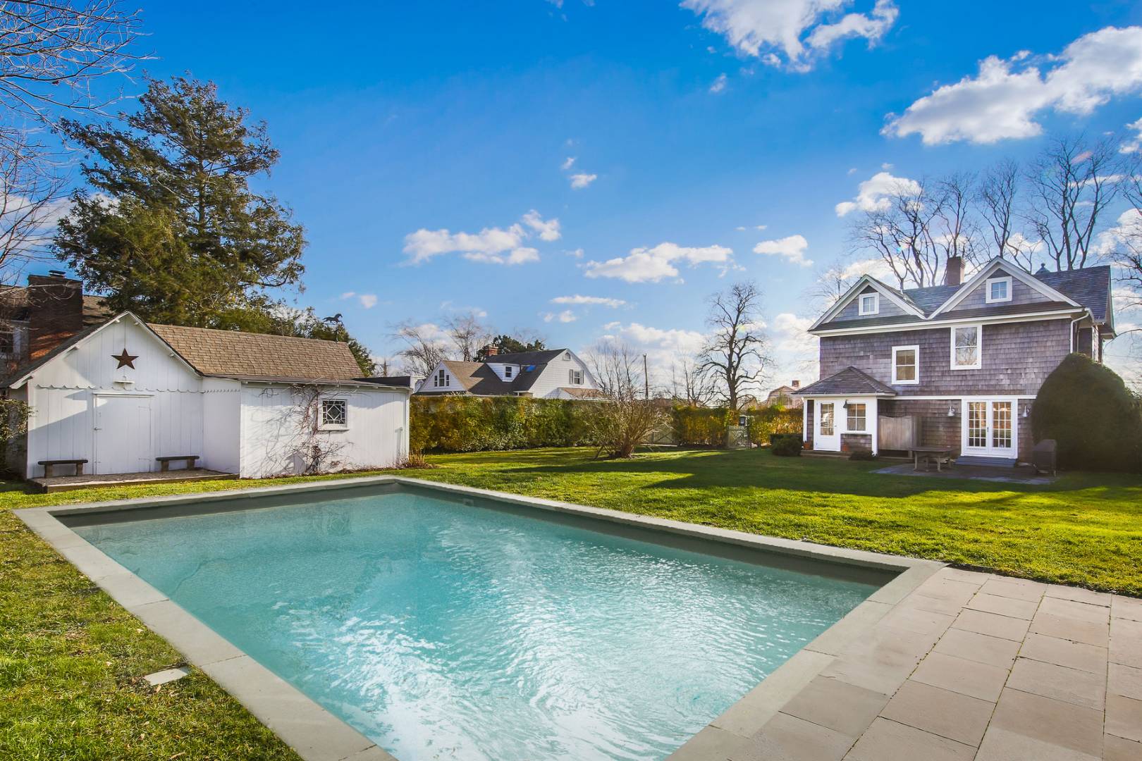 120 Halsey Lane Water Mill, NY 11976 - Photo 1 of 10 a view of a house with swimming pool