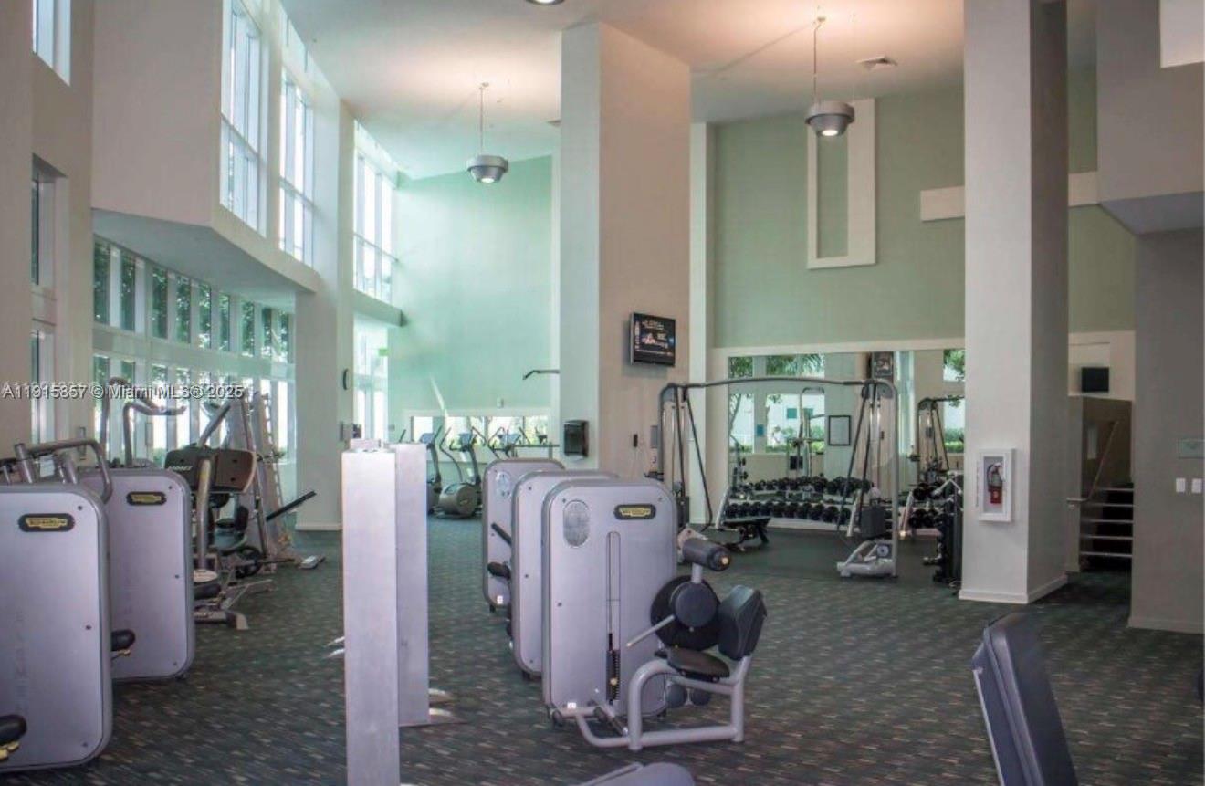 1900 North Bayshore Drive, Unit 3811 Miami, FL 33132 - Photo 24 of 27 a view of a livingroom with furniture and windows