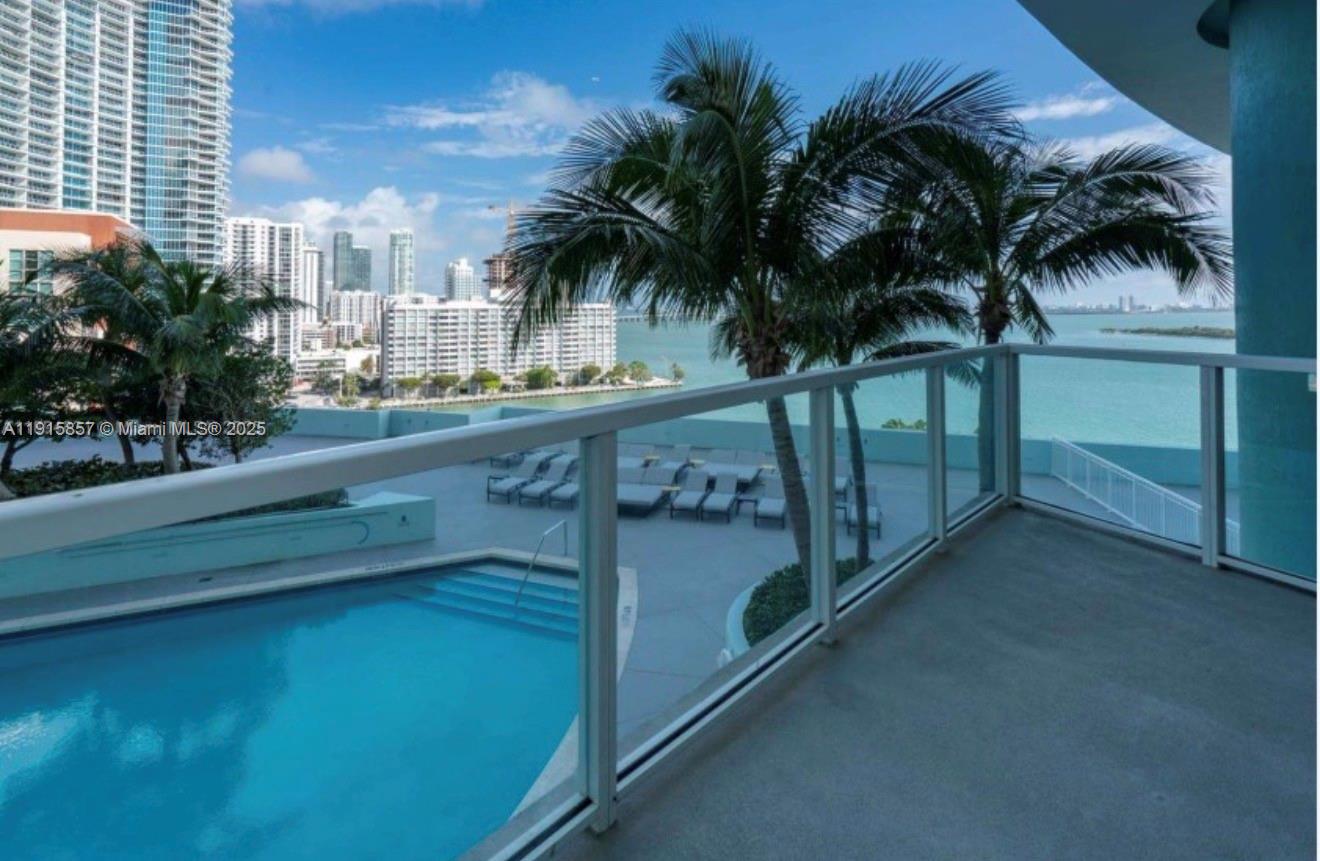 1900 North Bayshore Drive, Unit 3811 Miami, FL 33132 - Photo 26 of 27 a view of a swimming pool with a garden and outdoor seating
