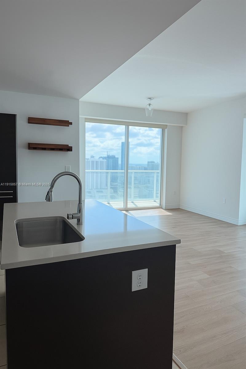 1900 North Bayshore Drive, Unit 3811 Miami, FL 33132 - Photo 6 of 27 a view of sink and mirror