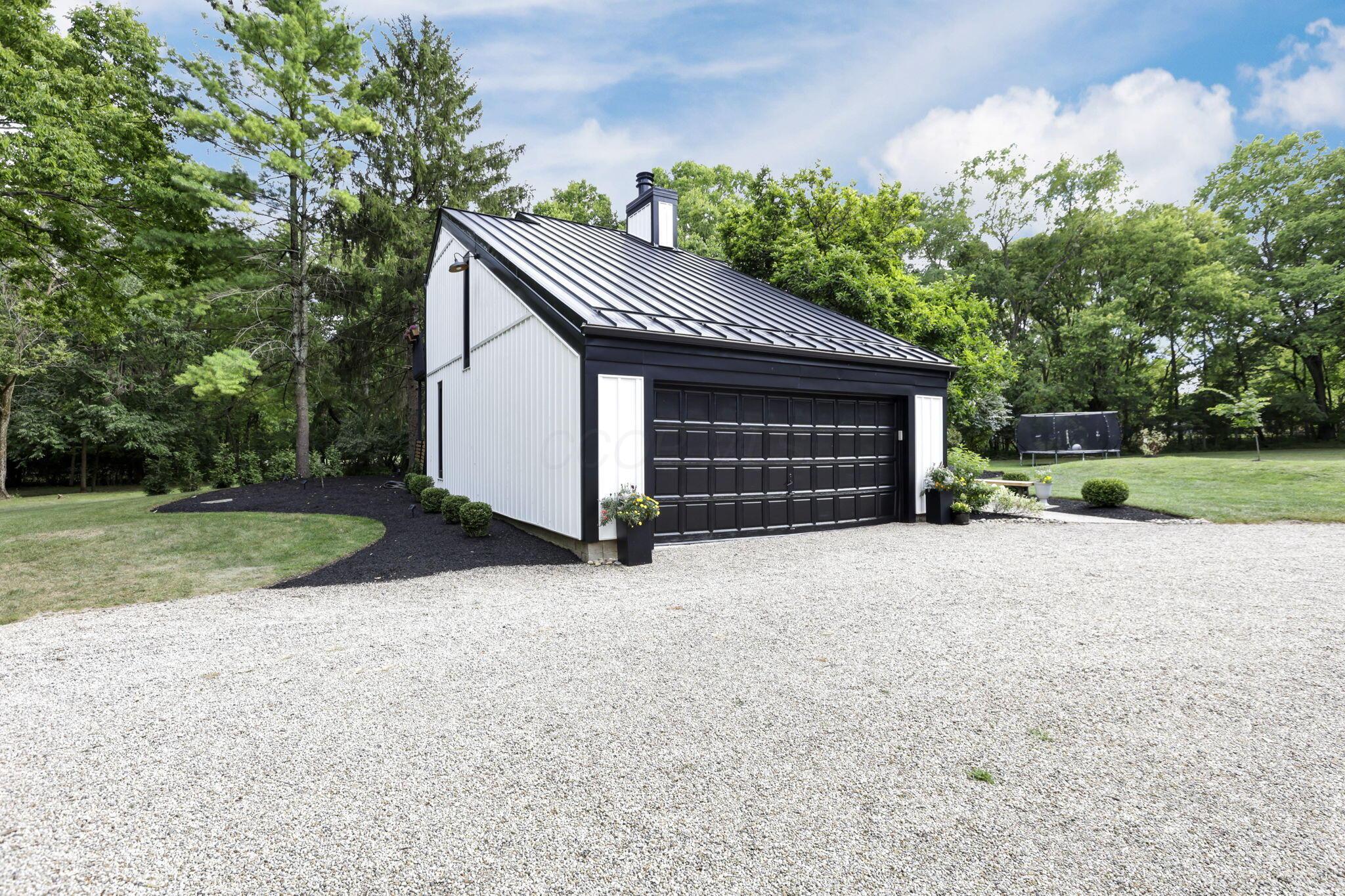 4390 Dublin Road Columbus, OH 43221 - Photo 75 of 83 Curved pebble driveway, Sturdy quality garage door.