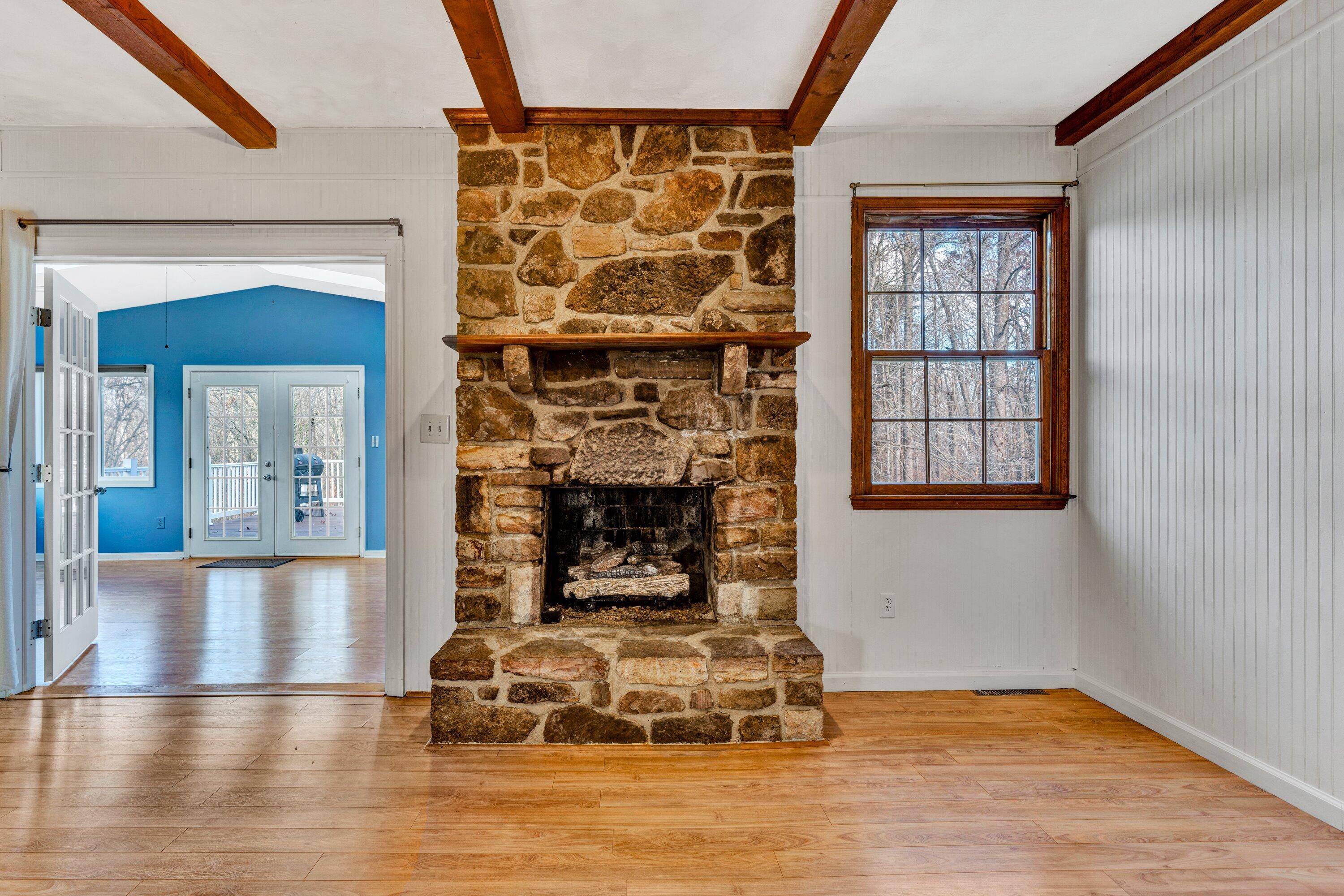 1319 Chandler Road Goodview, VA 24095 - Photo 16 of 53 a living room with furniture window and fireplace