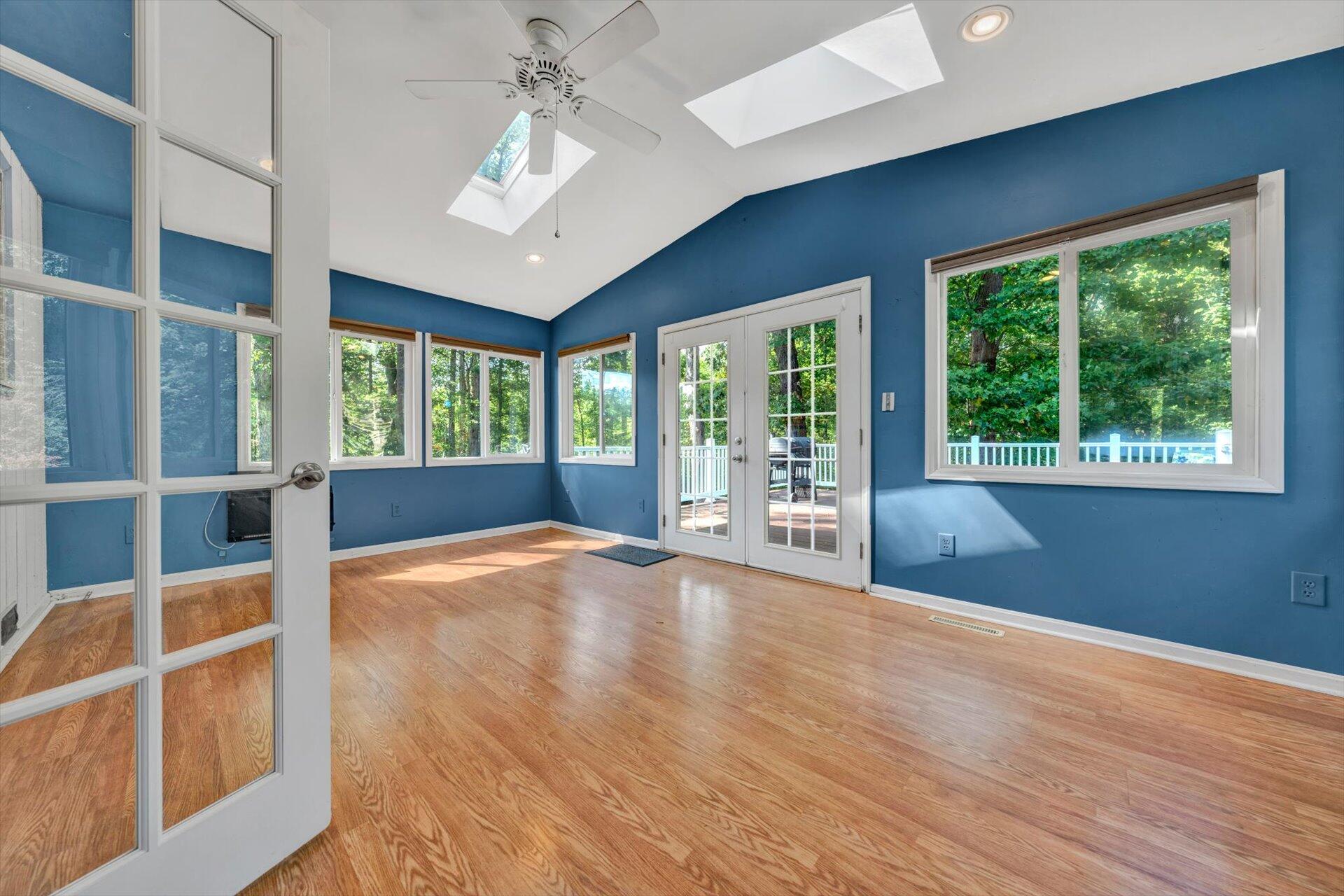 1319 Chandler Road Goodview, VA 24095 - Photo 17 of 53 a view of an empty room with wooden floor and a window