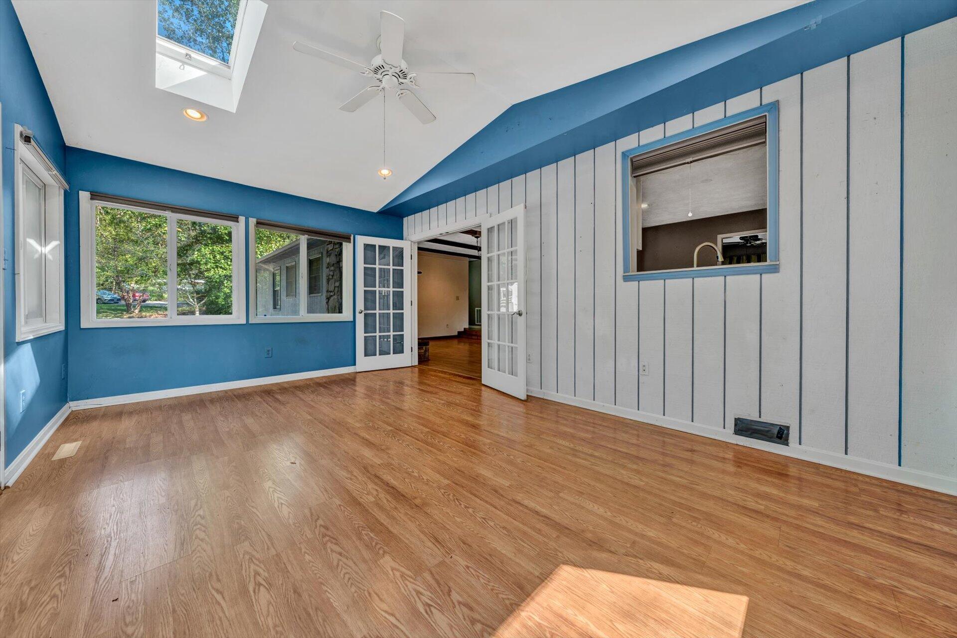 1319 Chandler Road Goodview, VA 24095 - Photo 18 of 53 a view of empty room with wooden floor and fan