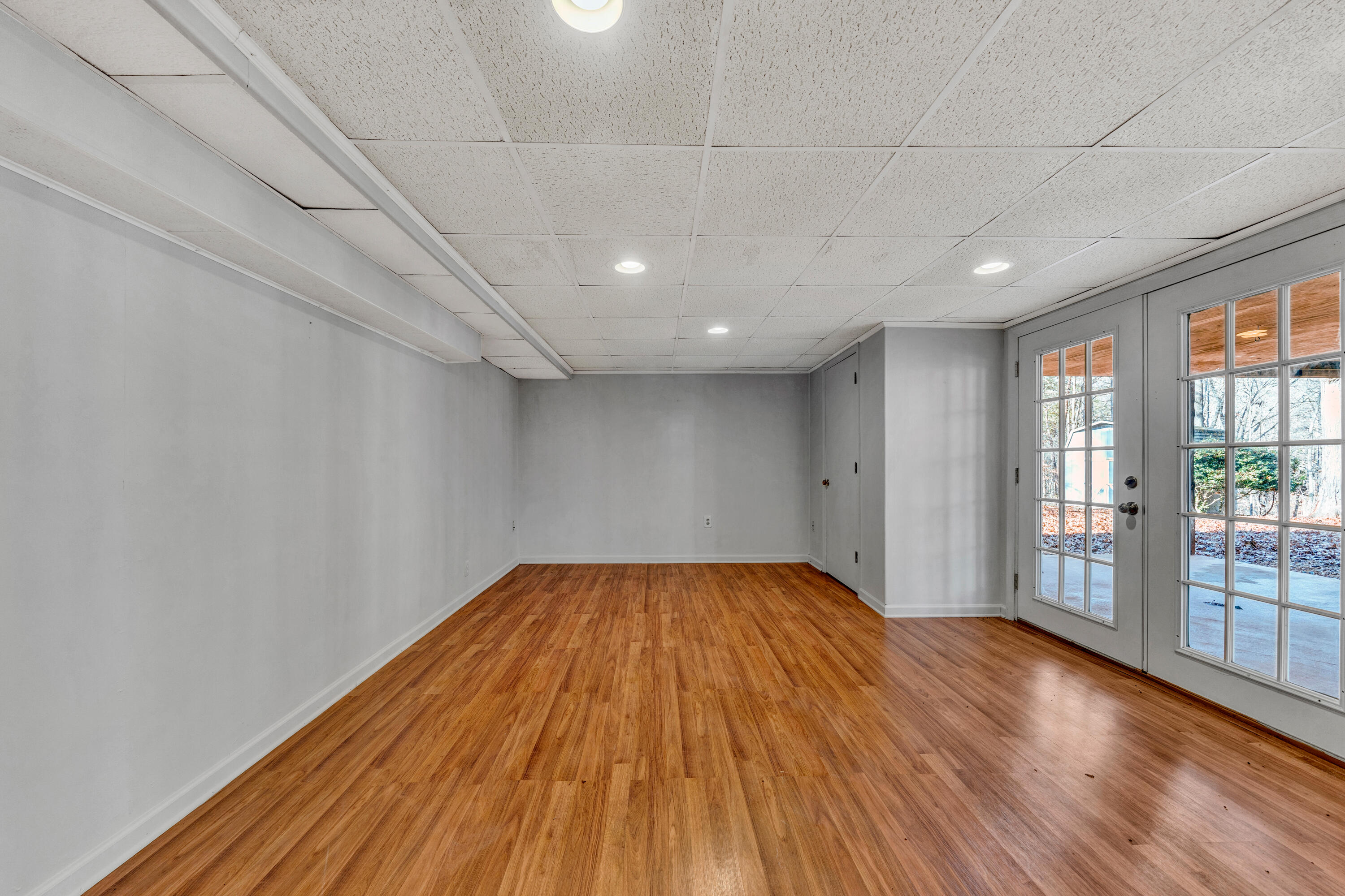 1319 Chandler Road Goodview, VA 24095 - Photo 32 of 53 a view of empty room with wooden floor and fan